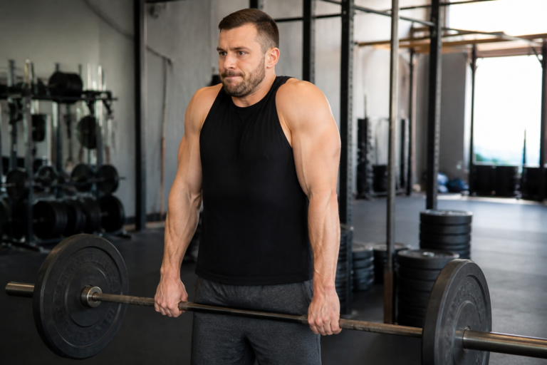Shrug barre : technique, amplitude et erreurs à corriger